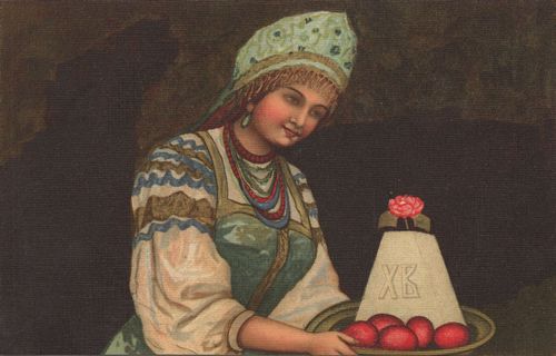 Russin mit Kuchen und Ostereiern
